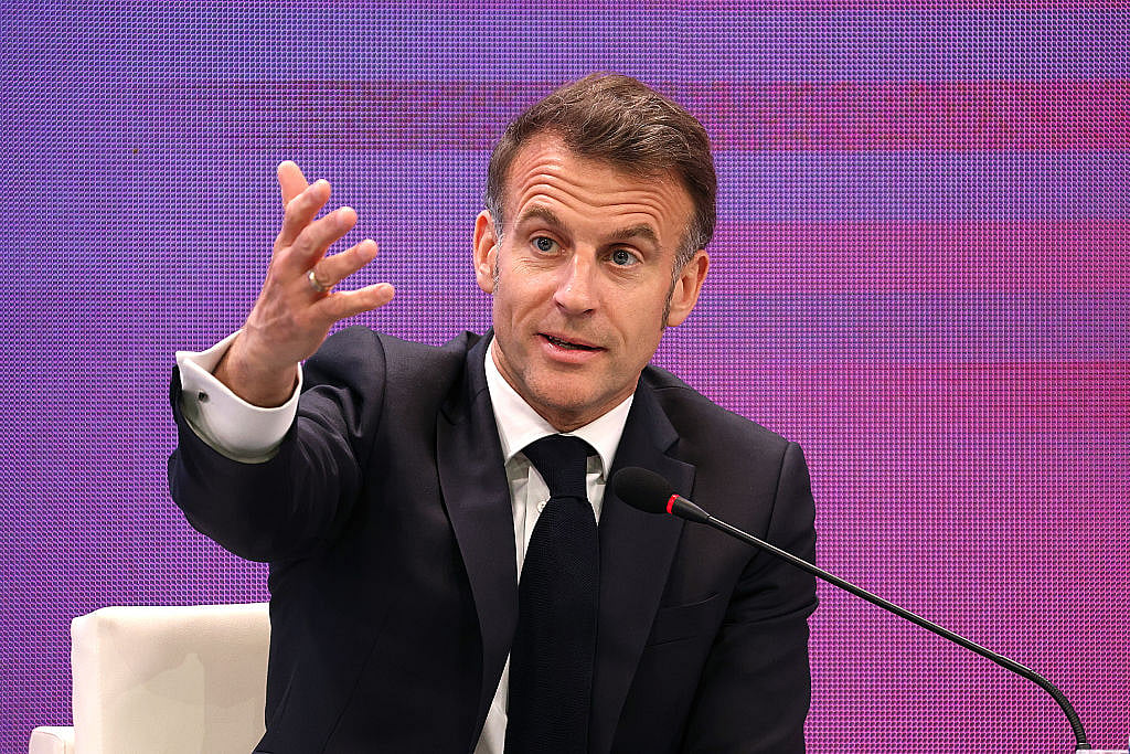 France's Macron slams migrant 'return-hubs', EU funding push