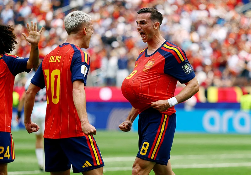 Spain's Fabian Ruiz celebrates scoring their first goal with Dani Olmo 