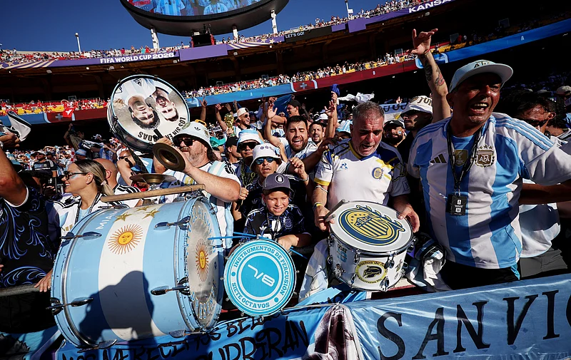 Soccer Football - FIFA World Cup 2026 - Quarter Final - Argentina v Switzerland - Kansas City Stadium, Kansas City, Missouri, U.S. - July 11, 2026
Argentina fans play drums displaying Lionel Messi and Diego Maradona inside the stadium before the match REUTERS/Lee Smith