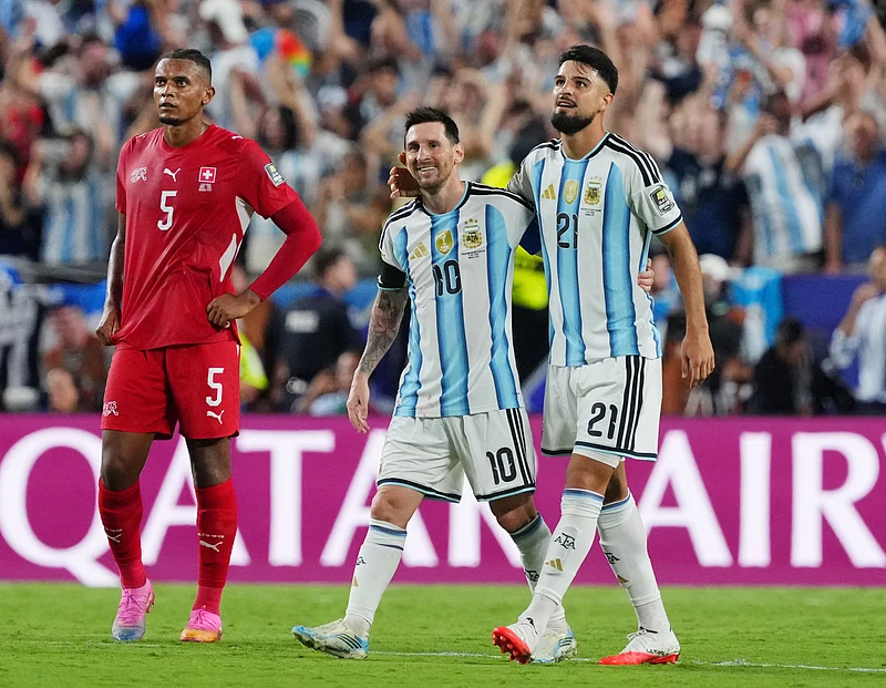 Football - FIFA World Cup 2026 - Quarter Final - Argentina v Switzerland - Kansas City Stadium, Kansas City, Missouri, U.S. - July 11, 2026
Argentina's Lionel Messi celebrates after the match with Jose Manuel Lopez as Switzerland's Manuel Akanji looks dejected 