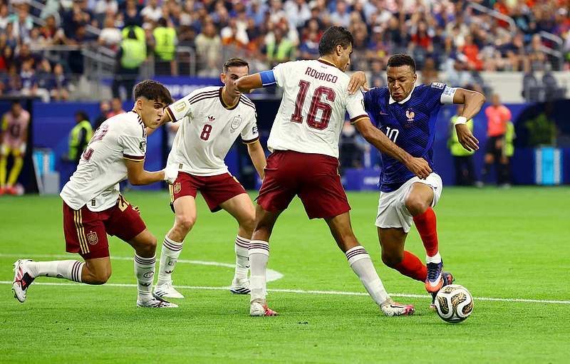 Football - FIFA World Cup 2026 - Semi Final - France v Spain - Dallas Stadium, Arlington, Texas, U.S. - July 14, 2026
France's Kylian Mbappe in action with Spain's Rodri 