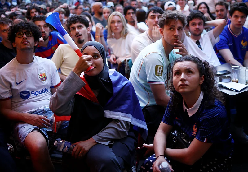  Football - FIFA World Cup 2026 - Semi Final - France v Spain - Fans gather in Paris - Paris, France - July 14, 2026
France fan with a vuvuzela as fans gather to watch the match 