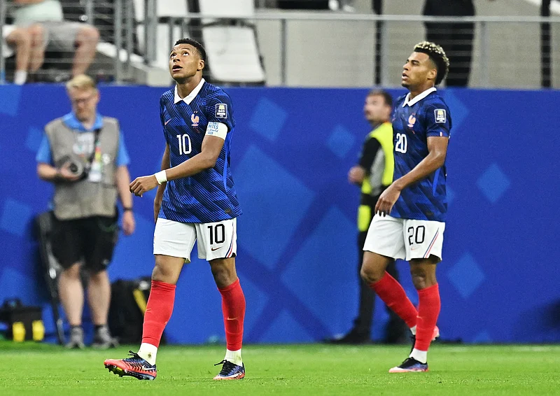 Football - FIFA World Cup 2026 - Semi Final - France v Spain - Dallas Stadium, Arlington, Texas, U.S. - July 14, 2026
France's Kylian Mbappe and Desire Doue look dejected after the match
