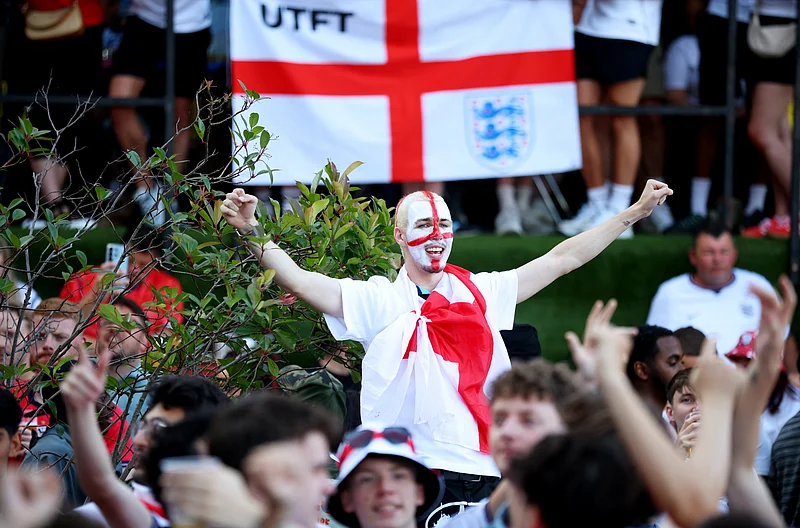 Soccer Football - FIFA World Cup 2026 - Semi Final - England v Argentina - Fans gather in Manchester - 4TheFans Fan Park, Freight Island, Manchester, Britain - - July 15, 2026
England fans react before the match REUTERS/Ed Sykes