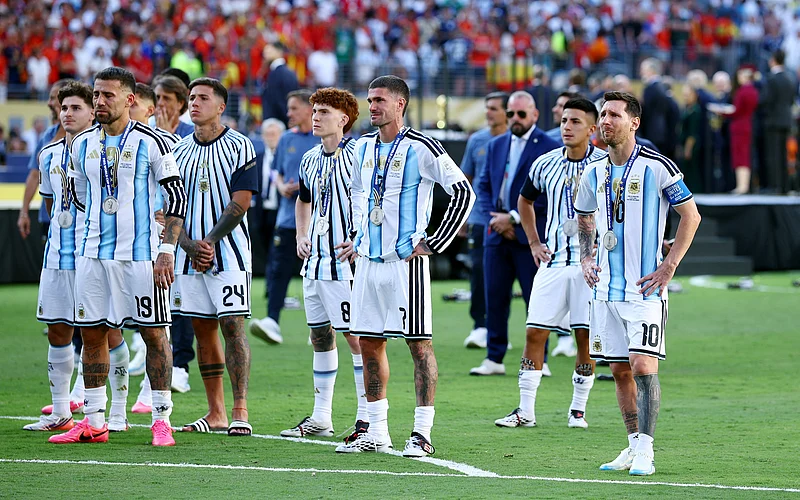 Soccer Football - FIFA World Cup 2026 - Final - Spain v Argentina - New York/New Jersey Stadium, East Rutherford, New Jersey, U.S. - July 19, 2026
Argentina's Lionel Messi, Nicolas Otamendi, Rodrigo De Paul and Enzo Fernandez look dejected with teammates after losing the World Cup final REUTERS/Agustin Marcarian