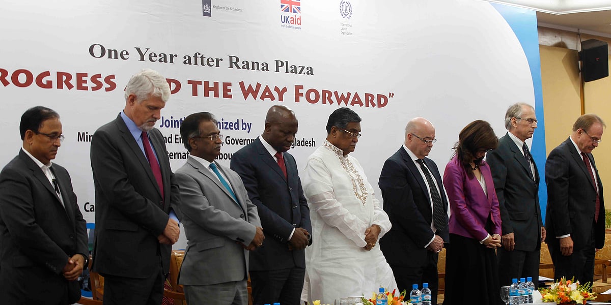 Guests at a function titled ‘One Year after Rana Plaza: Progress and the way Forward’ remain silent for a minute at ruposhi Bangla Hotel in Dhaka on Thursday to show respect to people who were killed at the Rana Plaza building collapse. Photo: Hasan Raza