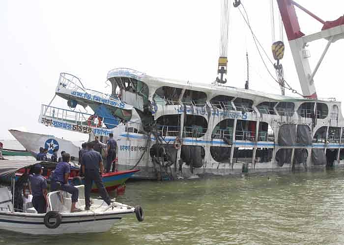 Rescue vessel pulls the capsized ferry MV Miraz out of Meghna water at Munshiganj on Saturday. Photo: Prothom Alo