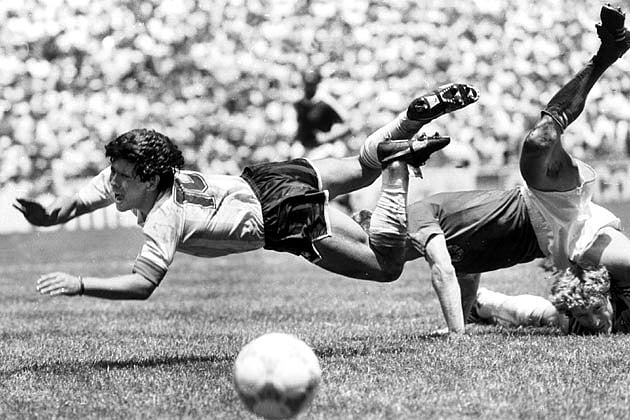 Argentina's Diego Maradona flies over Germany's goalie during the World Cup final in Azteca Stadium in Mexico City. Photo: Reuters