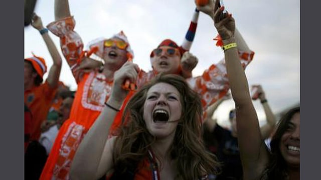 Dutch soccer fans celebrate a goal as they watch a broadcast of the 2014 World Cup soccer match between the Netherlands and Spain on a large screen at Copacabana beach in Rio de Janeiro, June 13, 2014. Reuters