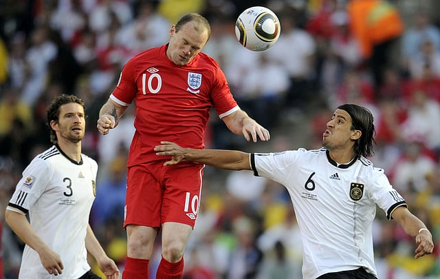 England's striker Wayne Rooney (C) heads the ball past Germany's defender Arne Friedrich (L) and Germany's midfielder Sami Khedira during the 2010 World Cup round of 16 football match against Germany on June 27, 2010 at Free State stadium in Mangaung. AFP