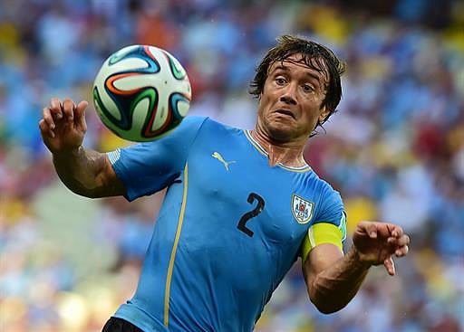 Uruguay's defender Diego Lugano in action during a Group D football match between Uruguay and Costa Rica at the Castelao Stadium in Fortaleza during the 2014 FIFA World Cup on June 14, 2014. AFP