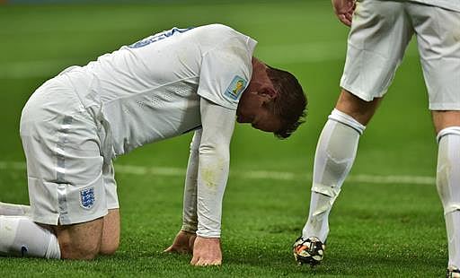 England's forward Wayne Rooney reacts during the Group D football match between Uruguay and England at the Corinthians Arena in Sao Paulo on June 19, 2014, during the 2014 FIFA World Cup. AFP