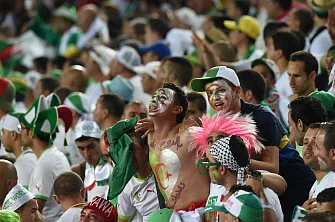 Algeria's supporters celebrate after their team's victory in the Group H football match between Algeria and Russia at The Baixada Arena in Curitiba on June 26, 2014, during the 2014 FIFA World Cup. AFP