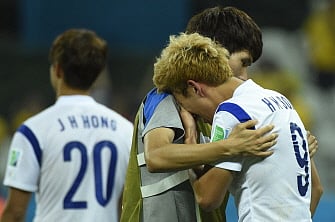South Korea's midfielder Son Heung-Min (R) reacts after a Group H football match between South Korea and Belgium at the Corinthians Arena in Sao Paulo during the 2014 FIFA World Cup on June 26, 2014. Belgium won 1 to 0. AFP