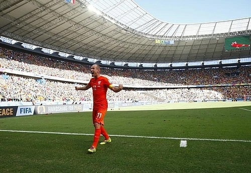 Arjen Robben of the Netherlands celebrates after winning their 2014 World Cup round of 16 game against Mexico at the Castelao arena in Fortaleza June 29, 2014. Photo: Reuters