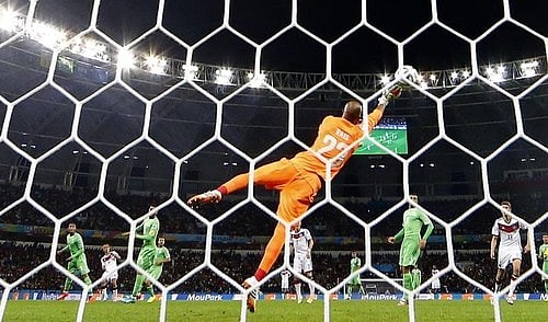 Algeria's goalkeeper Rais Mbolhi makes a save during the 2014 World Cup round of 16 game between Germany and Algeria at the Beira Rio stadium in Porto Alegre June 30, 2014. Photo: Reuters