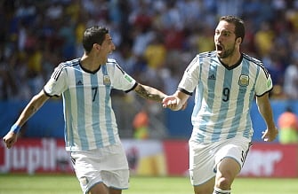 Argentina's forward Gonzalo Higuain (R) celebrates with Argentina's midfielder Angel Di Maria (L) after scoring during a quarter-final football match between Argentina and Belgium at the Mane Garrincha National Stadium in Brasilia during the 2014 FIFA World Cup on July 5, 2014. AFP