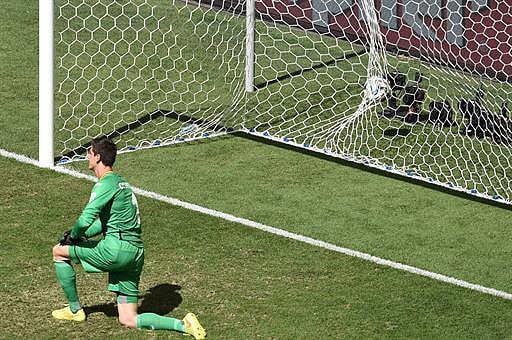 Belgium's goalkeeper Thibaut Courtois fails to stop a ball kicked by Argentina's forward Gonzalo Higuain during a quarter-final football match between Argentina and Belgium at the Mane Garrincha National Stadium in Brasilia during the 2014 FIFA World Cup on July 5, 2014. AFP