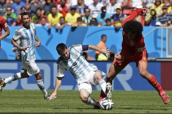 Argentina's forward and captain Lionel Messi (C) vies with Belgium's midfielder Marouane Fellaini during a quarter-final football match between Argentina and Belgium at the Mane Garrincha National Stadium in Brasilia during the 2014 FIFA World Cup on July 5, 2014. AFP