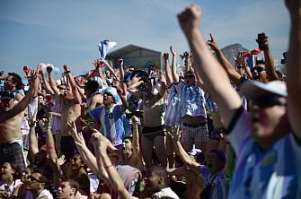 Argentina's cheer as they watch a live projection of the 2014 World Cup quarter-final match between Argentina and Belgium at Copacabana beach in Rio de Janeiro on July 5, 2014. AFP