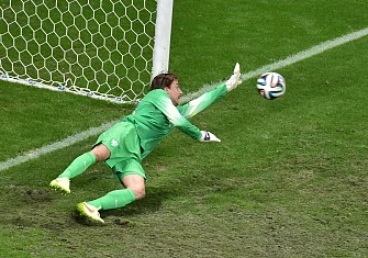 Netherlands' goalkeeper Tim Krul saves a penalty by Costa Rica's defender Michael Umana (not pictured) during the penalty shout out of a quarter-final football match between Netherlands and Costa Rica at the Fonte Nova Arena in Salvador during the 2014 FIFA World Cup on July 5, 2014. AFP