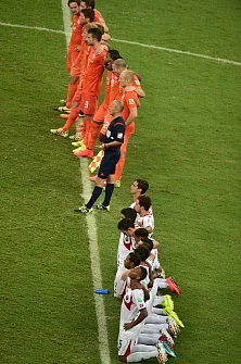 Players gather prior to the penalty shout out during a quarter-final football match between Netherlands and Costa Rica at the Fonte Nova Arena in Salvador during the 2014 FIFA World Cup on July 5, 2014. AFP