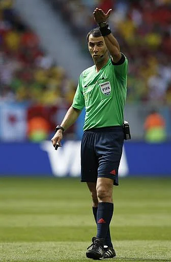 Uzbek referee Ravshan Irmatov reacts during a Group E football match between Switzerland and Ecuador at the Mane Garrincha National Stadium in Brasilia during the 2014 FIFA World Cup on June 15, 2014. AFP