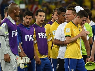 Brazil's midfielder Oscar reacts after the semi-final football match between Brazil and Germany at The Mineirao Stadium in Belo Horizonte during the 2014 FIFA World Cup on July 8, 2014. AFP