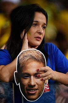 A fan of Brazil reacts during the semi-final football match between Brazil and Germany at The Mineirao Stadium in Belo Horizonte during the 2014 FIFA World Cup on July 8, 2014. AFP