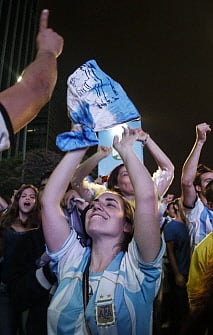 Argentine fans celebrate on the streets after beating the Netherlands in the FIFA World Cup Brazil 2014 semi-final football match in Sao Paulo, Brazil on July 9, 2014. Argentina beat the Netherlands 4-2 in penalty kicks and will face Germany in the FIFA World Cup final on July 13. AFP