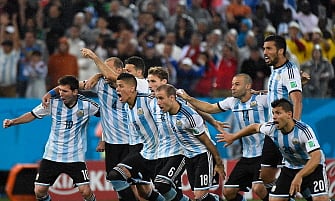 Argentina's team react after winning their FIFA World Cup semi-final match against the Netherlands in a penalty shoot-out following extra time at The Corinthians Arena in Sao Paulo on July 9, 2014. AFP