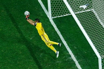 Argentina's goalkeeper Sergio Romero makes a save against Netherlands' midfielder Wesley Sneijder during penalty shoot-outs following extra time during the semi-final football match between Netherlands and Argentina of the FIFA World Cup at The Corinthians Arena in Sao Paulo on July 9, 2014. AFP