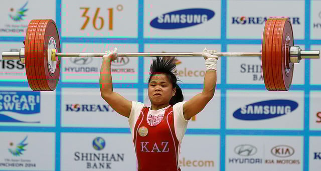 Kazakhstan's Zulfiya Chinshanlo attempts to break her own world record for the clean and jerk on her third attempt in the women's 53kg weightlifting competition at the Moonlight Garden Venue during the 17th Asian Games in Incheon on September 21, 2014. Reuters