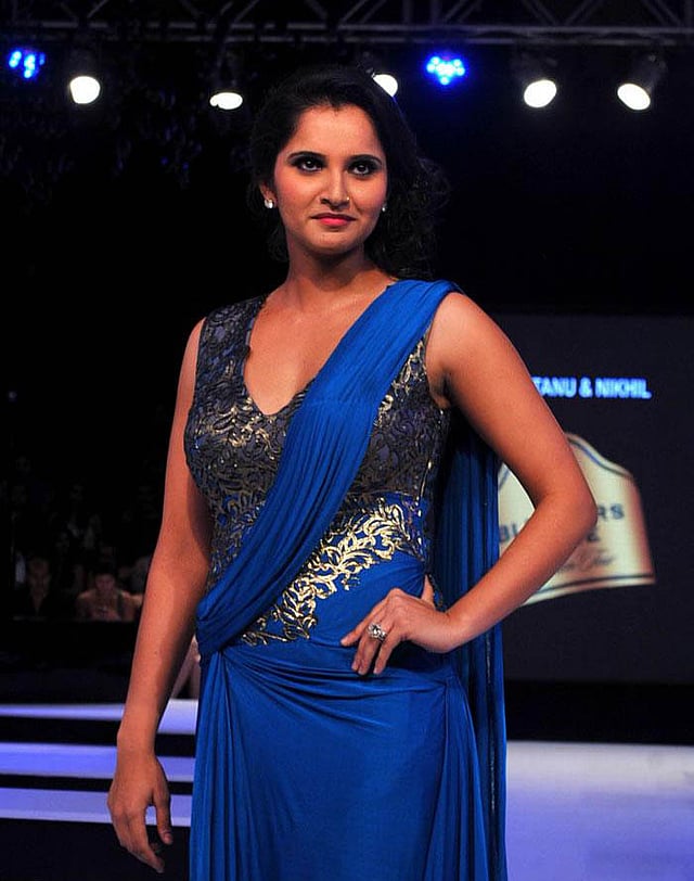 Sania Mirza takes the walk on the ramp in Mumbai during a fashion event. A look at how she and other sportspersons turn fashion models when they take to the ramp. Photo: AFP