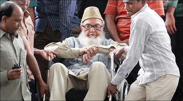 Ghulam Azam was taking out of the court after a hearing over war crime charges. File photo: AFP