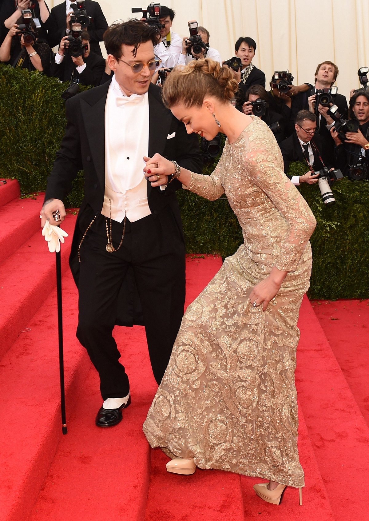 Photo shows actors Johnny Depp (L) and Amber Heard arriving at the Costume Institute Benefit at The Metropolitan Museum of Art in New York on 5 May 2014. Photo: AFP