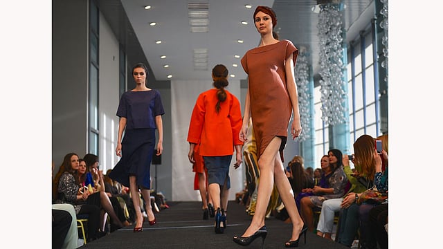 Models present creations by Belarusian designer Julia Gilevich during the Belarus Fashion Council in Minsk on April 24, 2015. Photo: AFP