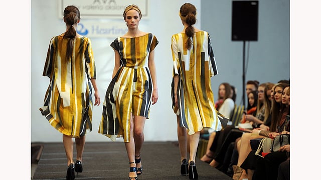 Models present creations by Belarussian designer Valeria Aksionava during the Belarus Fashion Council in Minsk on April 24, 2015. Photo: AFP