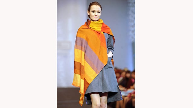 A model presents creations by Belarusian designer Julia Gilevich during the Belarus Fashion Council in Minsk on April 24, 2015. Photo: AFP