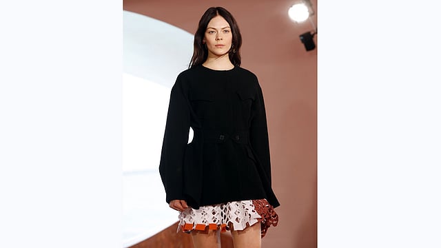 A model presents a creation by Belgian fashion designer Raf Simons during the Dior 2016 cruise collection show, on May 11, 2015 at the Palais Bulle in Theoule-sur-Mer, southeastern France. Photo:AFP