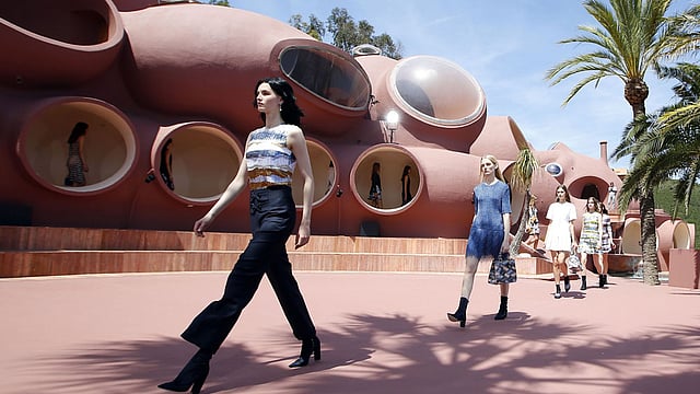 .  Models present creations by Belgian fashion designer Raf Simons during the Dior 2016 cruise collection show, on May 11, 2015 at the Palais Bulle in Theoule-sur-Mer, southeastern France.  Photo: AFP