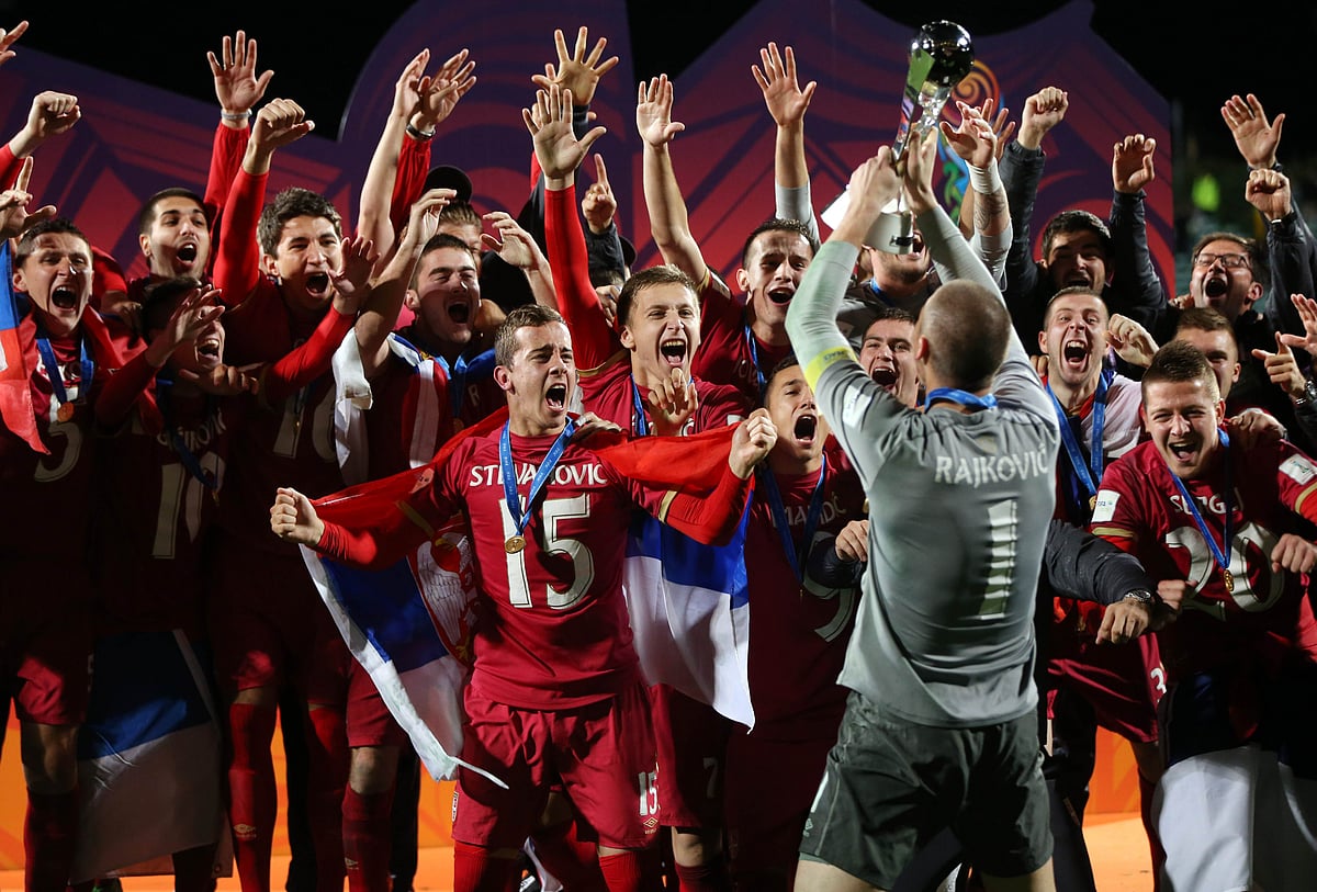 Serbiaplayers celebrate with the trophy after the FIFA Under-20 World Cup football final match between Brazil and Serbia in Auckland on June 20, 2015.  AFP