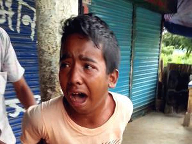 13-year Samiul Islam Rajan being tortured. Photo Courtesy: Social Network