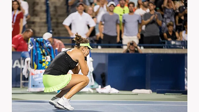 Belinda Bencic of Switzerland celebrates her victory over Serena Williams of the United States during their semi-final match at Aviva Centre at York University in Toronto on August 15, 2015. Photo: AFP
