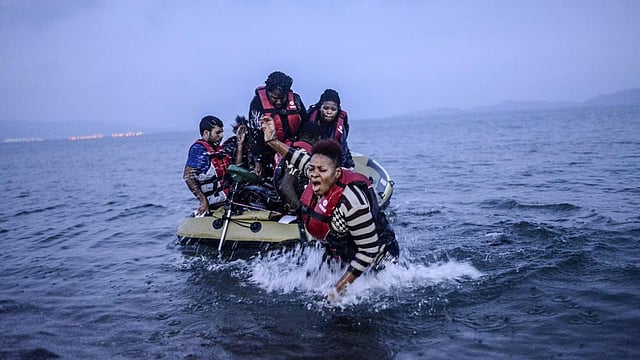 An African migrant tries to come back the shore after failing to board a boat to the Greek island of Kos on early August 16, 2015 off the shore of Bodrum, southwest Turkey. Photo: AFP