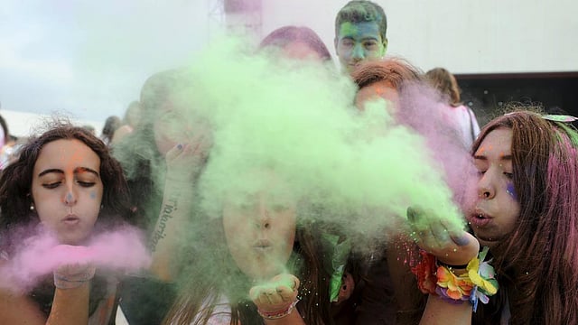 Revellers take part in the Holi Party Festival at the Niemeyer Center in Aviles, northern Spain, August 29, 2015. Photo: Reuters