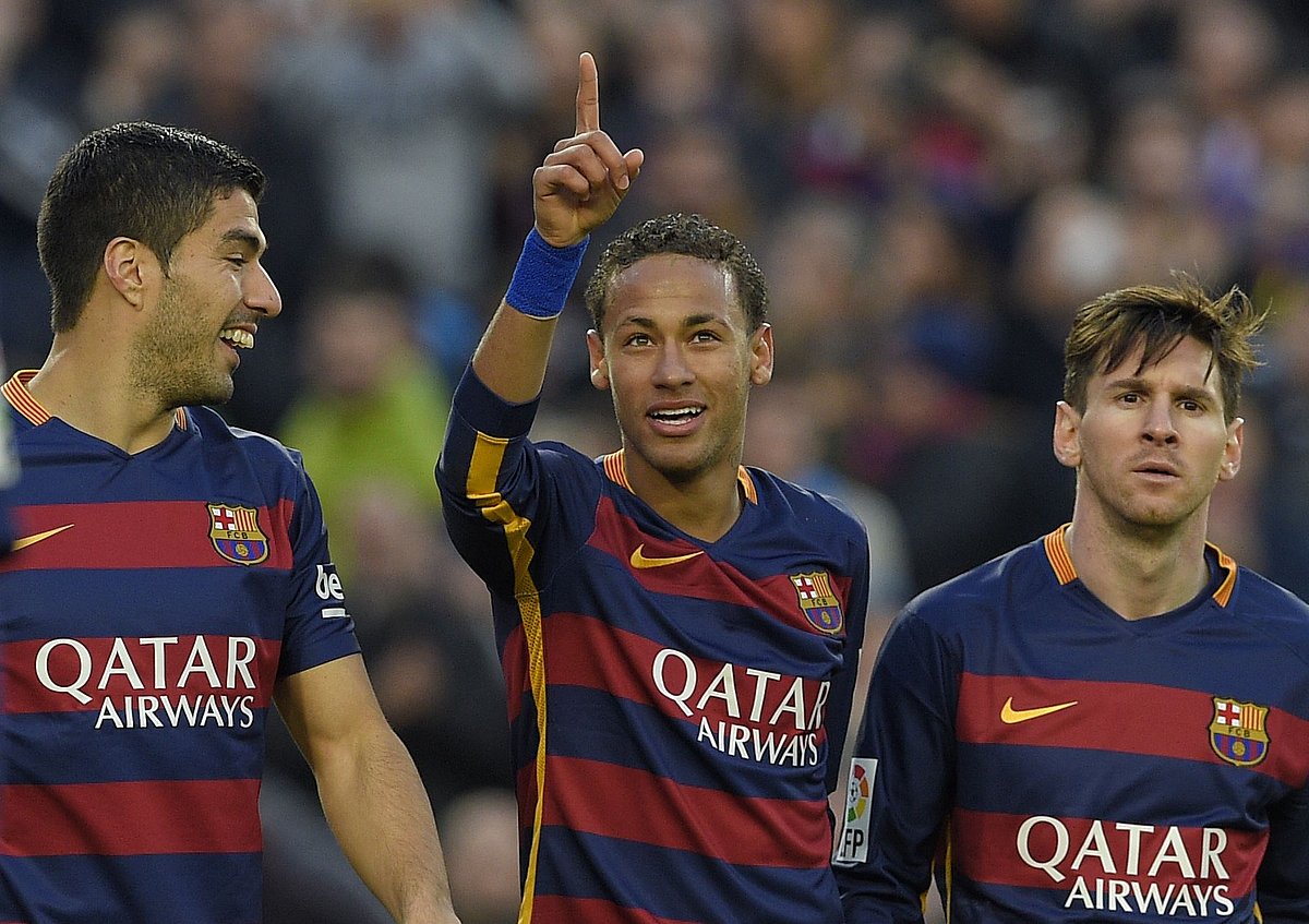 Barcelona forward Neymar (C) celebrates with Luis Suarez (L) and Lionel Messi after scoring their third goal during the Spanish league football match FC Barcelona vs Real Sociedad de Futbol at the Camp Nou stadium in Barcelona on Saturday. AFP photo