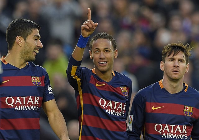 Barcelona forward Neymar (C) celebrates with Luis Suarez (L) and Lionel Messi after scoring their third goal during the Spanish league football match FC Barcelona vs Real Sociedad de Futbol at the Camp Nou stadium in Barcelona on Saturday. AFP photo
