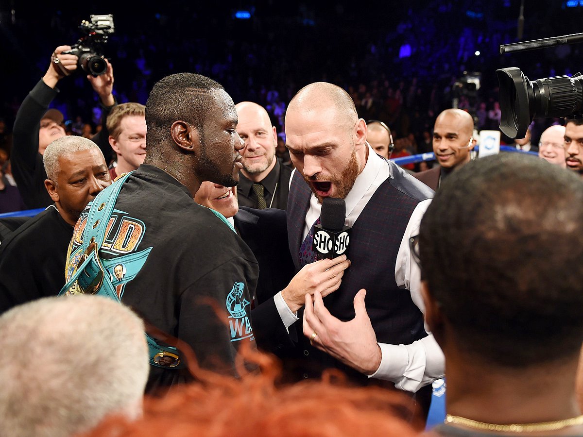 Tyson Fury of Britain (R) challeges Deontay Wilder of the US (L) after Wilder defeated Artur Szpilka of Poland in their WBC Heavyweight Championship bout at Barclay`s Center in Brooklyn. Photo: AFP