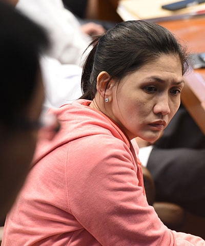 In this photo taken on 17 March Maia Deguito, manager of the Rizal Commercial Banking Corp (RCBC) branch in Manila`s financial district, attends a senate hearing in Manila. Photo: AFP